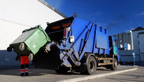 Front view of commercial waste collection vehicle parked in Ickenham street